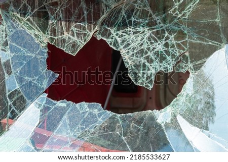 Broken windshield of the car. The car got big hole at windshield, accident Royalty-Free Stock Photo #2185533627