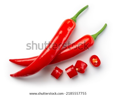 Chili pepper isolated. Chilli top view on white background. Whole and cut red hot chili peppers top. With clipping path. Royalty-Free Stock Photo #2185557755