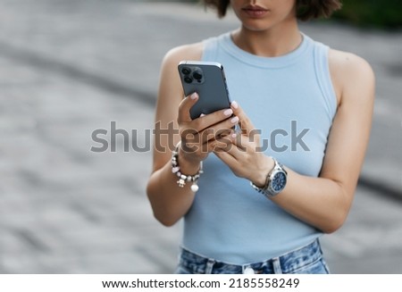 Portrait of a smiling Business woman Using iPhone