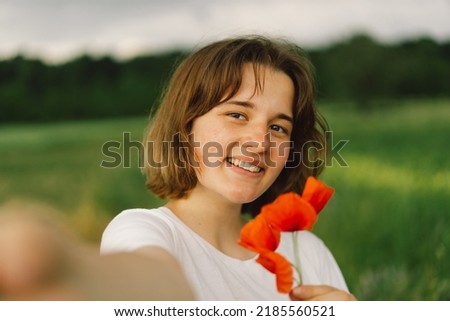 Teenager Girl smiling and looking in camera and takes a selfie. Lifestyle concept. Portrait Of Teenager Girl