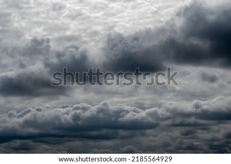 Dark storm clouds cover the sky. Atmospheric phenomenon. Background picture.