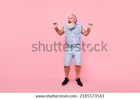 Full length photo of funny excited man pensioner dressed denim vest headphones singing isolated pink color background