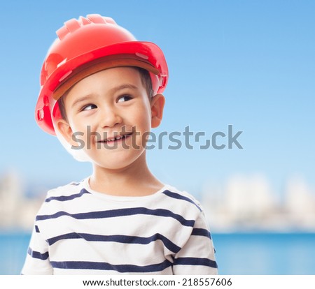 portrait of a little boy wearing a mason helmet