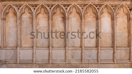 Gothic pointed arches on the outside wall of a church Royalty-Free Stock Photo #2185582055
