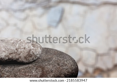 A Rock Shelf for a Product Display, Flat Surface of the Textured Stone, with a Light Background.