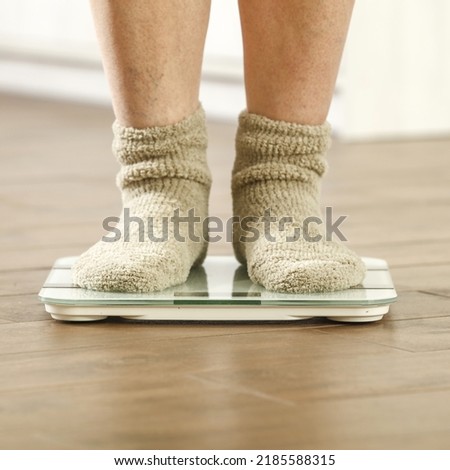 Woman legs in socks and foot weight