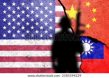 United States of America, China and Taiwan  flags painted on the concrete wall with soldier shadow. USA and China war concept Royalty-Free Stock Photo #2185594229