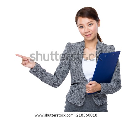 Businesswoman with clipboard and finger point aside