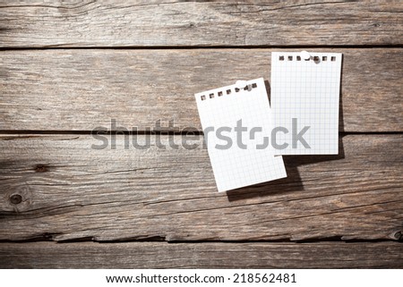 two paper on wooden background 