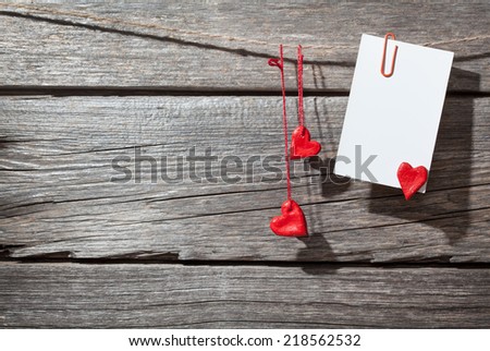 paper with hearts on a wooden background 
