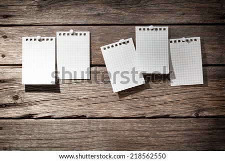 five photo paper on wooden background 