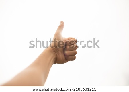 Hand with thumbs up. Think positive concept. 