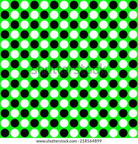 repeating white and black circles on a green background