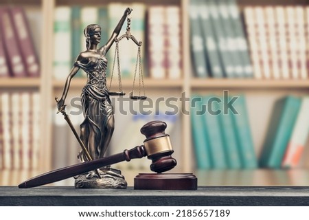 Legal office of lawyers, justice and law concept, scale of justice on a desk in a courtroom, Royalty-Free Stock Photo #2185657189