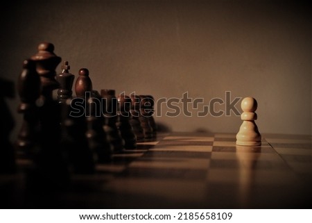 Chess scene, with one pawn facing its opposing side Royalty-Free Stock Photo #2185658109