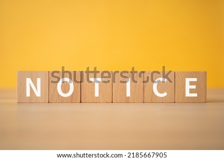 Wooden blocks with "NOTICE" text of concept.