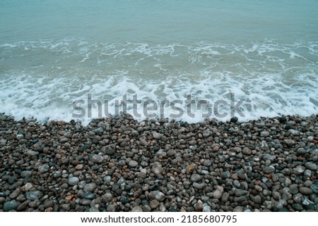 French coastline of Normandy in France with pebbles beaches, part of the typical landscape 