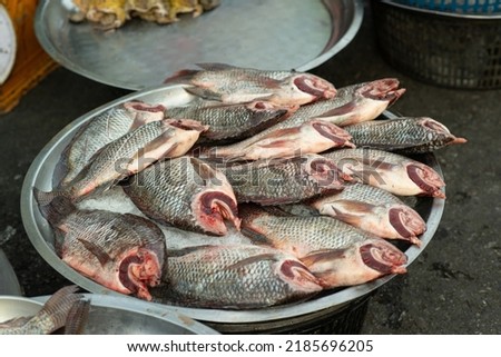 Animal products for cooking are sold at the street food market. Fresh fish meat is a popular traditional Thai food in the morning market.