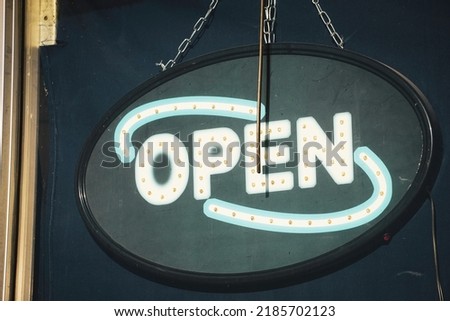 Open sign in business window