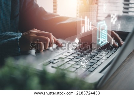 Enterprise Resource Planning ERP, document management concept with icons on virtual screen, Business woman working with laptop computer with icons on virtual screen on office desk