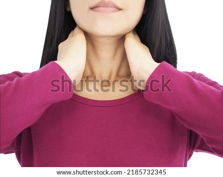 Young woman has a sore throat caused by tonsillitis. Closeup photo, blurred.