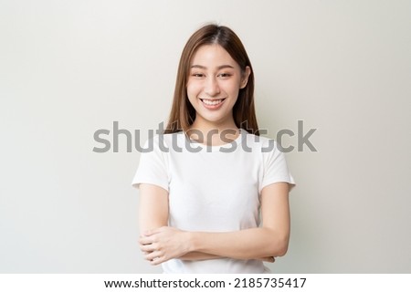 happy young asian woman smiling isolated on background.