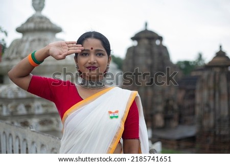Girl saluting in Patriotic mood on the Occasion of Independence Day of India. Indian Culture  Royalty-Free Stock Photo #2185741651