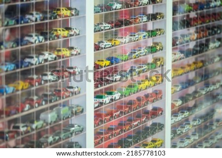 Blurred image of toy car racks for boys.