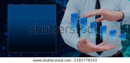 Businessman With Digitally Generated Bar Graph And Line Graph With Arrow Moving Up In Hands. Man Showing Data And Box With Copy Space For Advertisement And Branding.