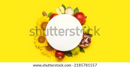 Composition for Rosh Hashanah (Jewish New Year) with blank card on yellow background