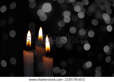 Candle flame shot with bokeh background, idea and inspiration light of hope copy space for text and individual design