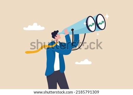 Financial forecast, vision for stock market investment return, make profit opportunity, discover economic recover, businessman financial professional look through binocular to see graph and chart. Royalty-Free Stock Photo #2185791309