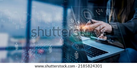Double exposure of businesswoman using digital laptop and tablet with stock market graph or forex trading chart, Business management software concept.
