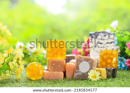 Natural handmade soap on green grass as nature. Salt soap healthy skin cleaning. Bath soap for body and face. Organic salt soap for spa and body care. Royalty-Free Stock Photo #2185834577