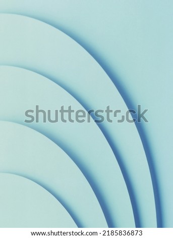 Abstract background of curved shapes and gradient of light blue tones