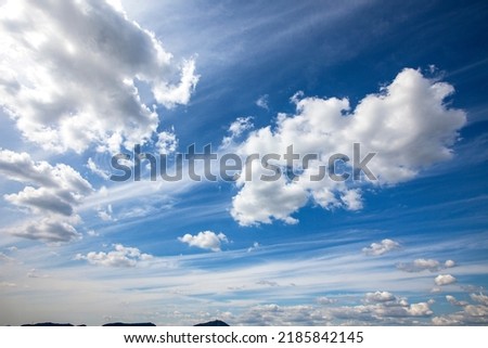 a dynamic cloud in the blue sky Royalty-Free Stock Photo #2185842145
