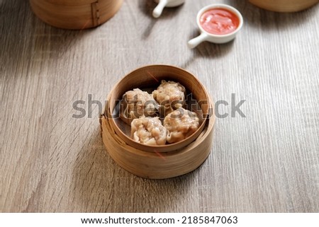 Traditional Food Chicken Dimsum on The Bamboo Bowl Royalty-Free Stock Photo #2185847063