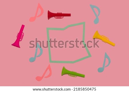 frame surrounded by colorful trumpets and musical notes, creative art design, copy space, music background
