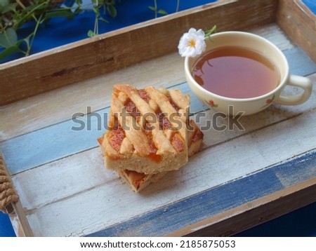 Greek jam tart, pasta flora and a cup of tea Royalty-Free Stock Photo #2185875053