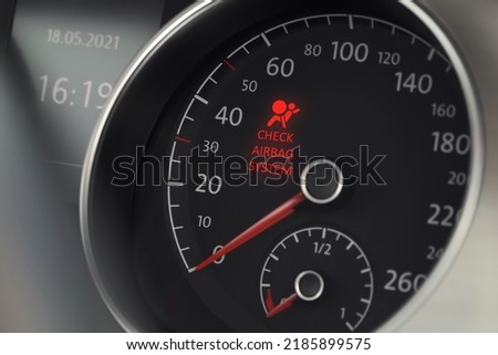 Closeup view of dashboard with warning icon check airbag system in car Royalty-Free Stock Photo #2185899575