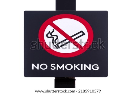 Large, close-up no smoking sign on pole with warning words and red and white cigarette icon. Isolated on white background.