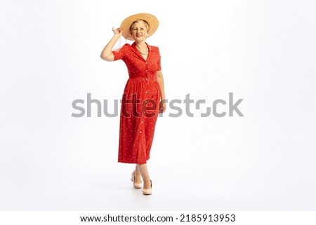 Lady in hat. Portrait of beautiful senior woman in retro vintage style outfit posing isolated on white background. Concept of beauty, old generation, fashion, emotions. Copy space for ad Royalty-Free Stock Photo #2185913953