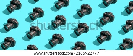 Banner with pattern from many cameras on a colored background. World Photography Day concept. Royalty-Free Stock Photo #2185922777