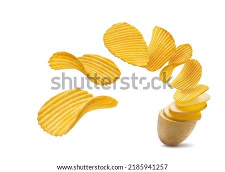 Realistic potato turning into ripple wavy chips. Flying and falling crunchy, crispy ripple potato chips. Isolated realistic potato turning into chips salty snack Royalty-Free Stock Photo #2185941257