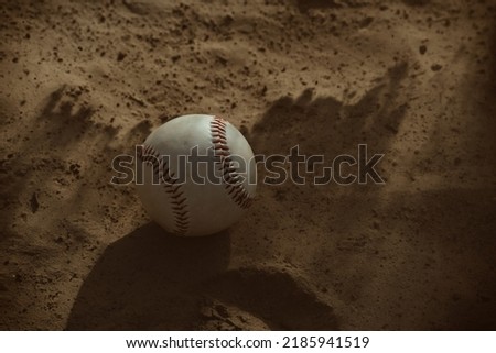 Baseball on field with dust motion over ball for sports game concept during summer.