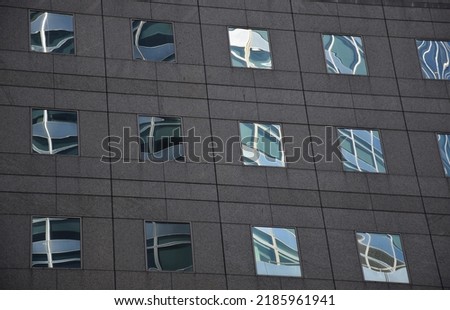 Window block on brown building.