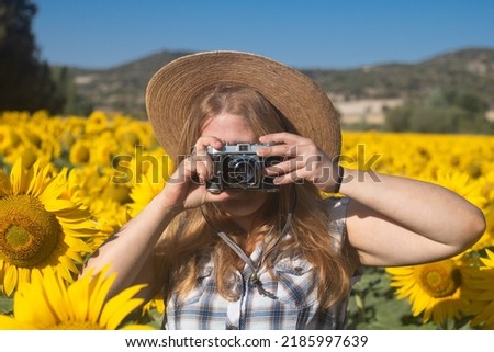 Taking photos in sunflower field