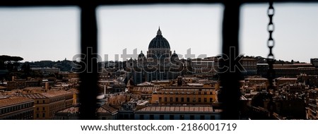 dome of saint peter of rome seen from ancient window
