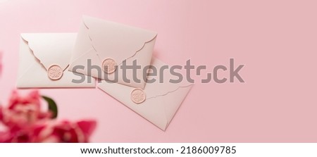 Photography from above of group of gift certificates.Tender pink color,banner with copy space.