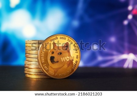 Dogecoin cryptocurrency stack with abstract background and copy space Royalty-Free Stock Photo #2186021203